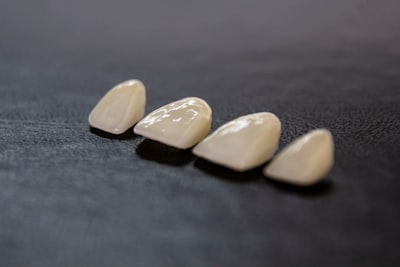 white and yellow wooden condiment shakers